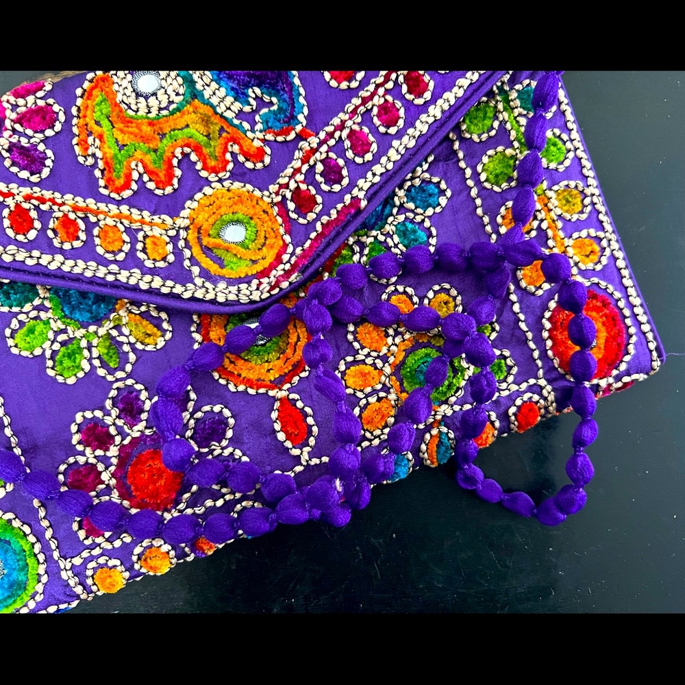 New embroidery and mirror detailed clutch